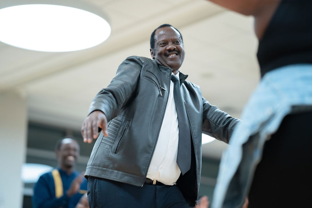 Elder dancing joyfully at ImenaUS event